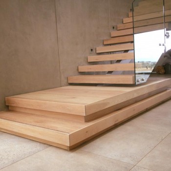 Centre spine Oak staircase with Panga Panga inlays