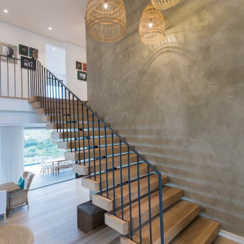 Centre spine Oak staircase with Panga Panga inlays