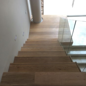 Floating Oak staircase with Panga Panga inlays