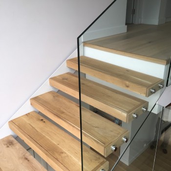 Floating Oak staircase with Panga Panga inlays