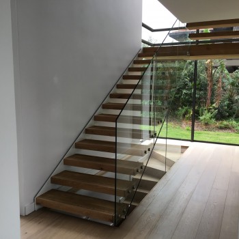 Floating Oak staircase with Panga Panga inlays