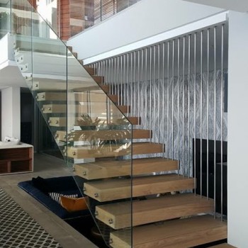 Centre spine Oak staicase with Panga Panga inlays