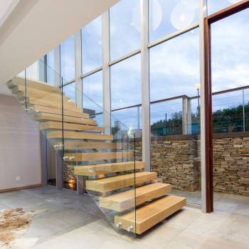 Centre spine Oak staircase with Panga Panga inlays